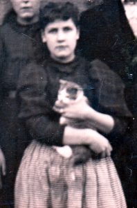My grandmother, Mattie Kilborn holding a kitten, circa 1895