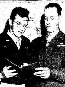 Sgt. Christos H. Karaberis, right, holder of the Congressional Medal of Honor and newest member of the Army and Air Force recruiting station at 10th and Jackson Streets, shows his CMH citation to Capt. A.L. Caldwell, recruiting offer. Karaberis received the Nation's highest military decoration from President Truman for wiping out five German machien guns nests single-handed. "I only wish finding a place to live was half as easy," Karaberis said.--Tribune photo