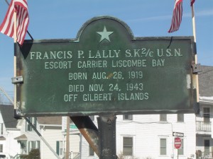 Photograph of Gerald R. Helmich recognition plaque, located in Manchester NH at the corners of Second and West Hancock Streets. Copyright of Martin Miccio for the City of Manchester, and used here with permission.
