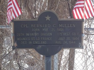 Photograph of Roland A. Metivier recognition plaque, located in Manchester NH at the southwest corner of Willow and Baker Streets. Copyright of Martin Miccio for the City of Manchester, and used here with permission.