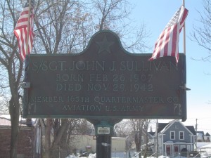 Photograph of John J. Sullivan recognition plaque, located in Manchester NH at the corners of Massabesic Street and Valley Street. Copyright of Martin Miccio for the City of Manchester, and used here with permission.