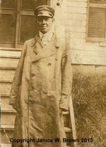 An early photograph of Charles A. Manning, in his driver's coat (probably pre-1918).