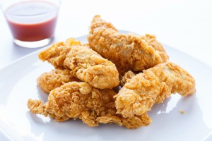 PHOTOGRAPH © Dbvirago | Dreamstime.com - Chicken Strips With Hot Pepper Sauce Photo