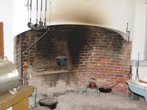 Photograph of a typical colonial fireplace used for cooking.
