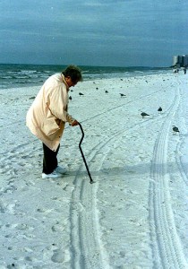 My mom doing her absolutely favorite thing: walking in the sand at the ocean.